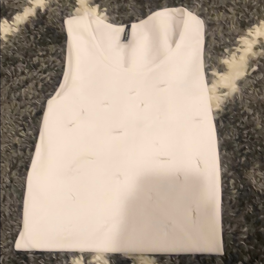 A ripped white sugar lips tank